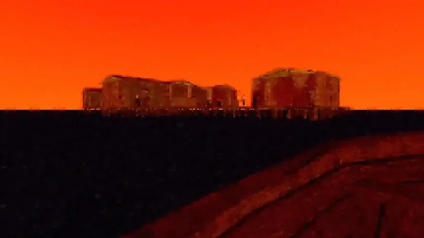 Low Frequency horror game town in the distance with an orange sky in the background
