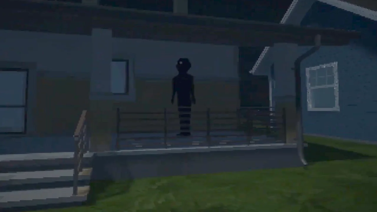 Shadowy figure standing in front of a house at night